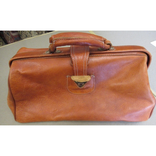 62 - Tan leather attaché case by Piquadro, together with another leather briefcase