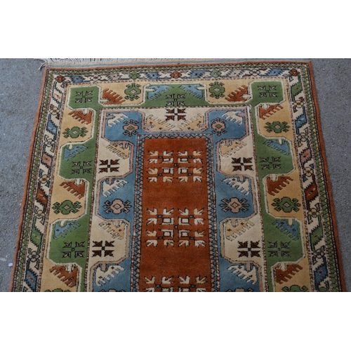 7 - Modern Milas (Turkey) rug with a rectangular centre medallion and double border, in shades of rust, ... 