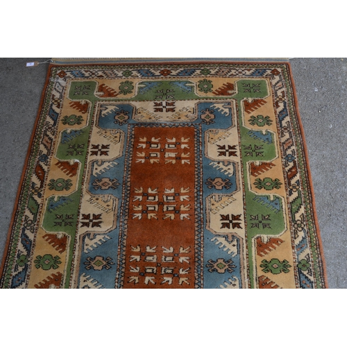 7 - Modern Milas (Turkey) rug with a rectangular centre medallion and double border, in shades of rust, ... 