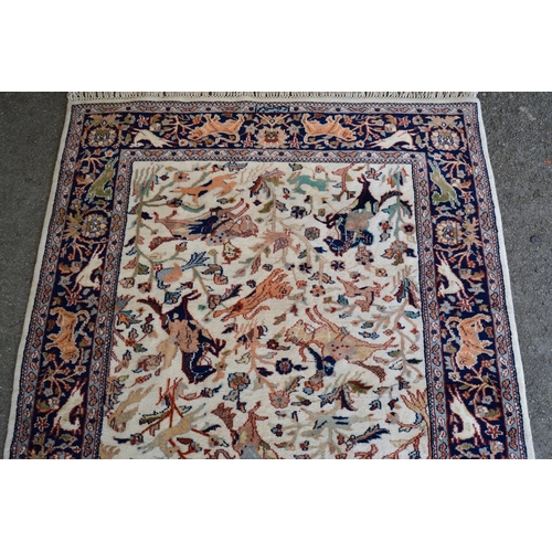 8 - Modern Indo Persian rug with an all-over hunting design on an ivory ground with borders, 180cms x 12... 