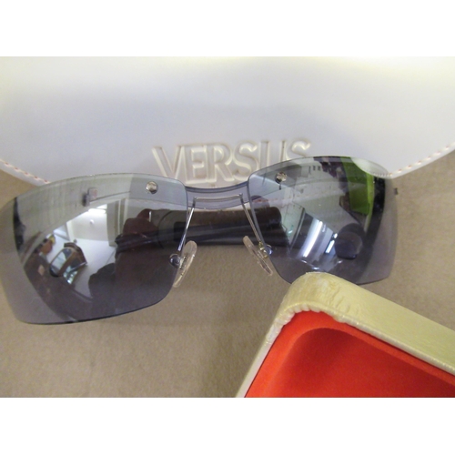 82 - Pair of Versace Versus sunglasses in original case, together with a pair of Calvin Klein sunglasses ... 