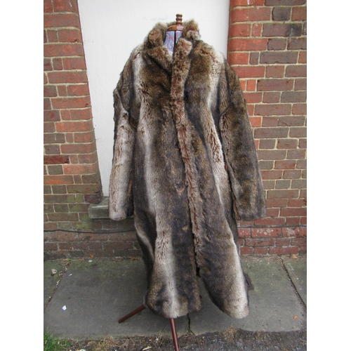 88 - Three Issey Miyake coats, together with a brown faux fur full length coat and two Katherine Hamnet i... 