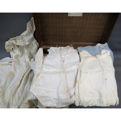 65 - Suitcase containing a quantity of early and late 19th Century clothing including dresses, Christenin... 