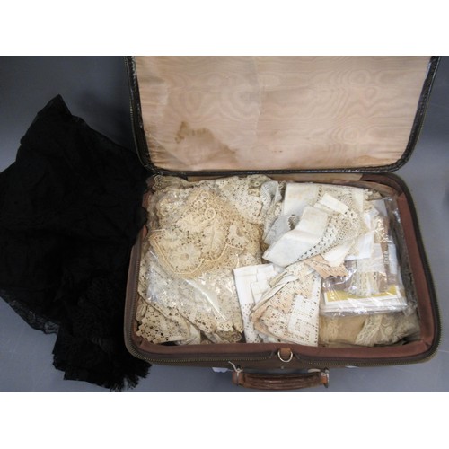 68 - Small brown case containing a quantity of various antique linen, crochet work and other lace edges e... 