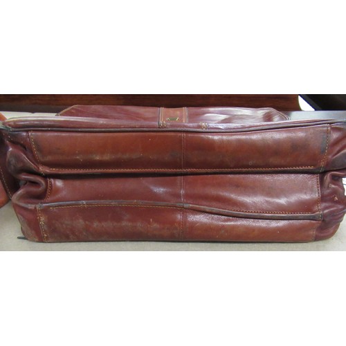 62 - Tan leather attaché case by Piquadro, together with another leather briefcase