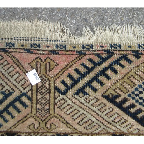 48 - Turkoman rug, the three rows of gols and multiple borders, on a faded red ground, together with anot... 