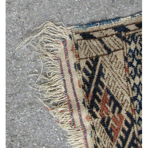 49 - Turkoman rug, the three rows of gols and multiple borders on a washed beige, red and blue ground, to... 