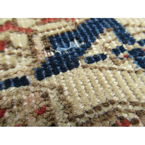 49 - Turkoman rug, the three rows of gols and multiple borders on a washed beige, red and blue ground, to... 