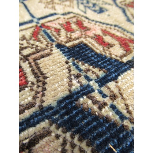 49 - Turkoman rug, the three rows of gols and multiple borders on a washed beige, red and blue ground, to... 