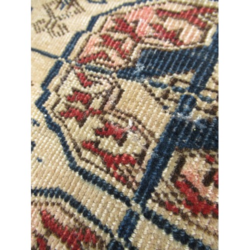 49 - Turkoman rug, the three rows of gols and multiple borders on a washed beige, red and blue ground, to... 