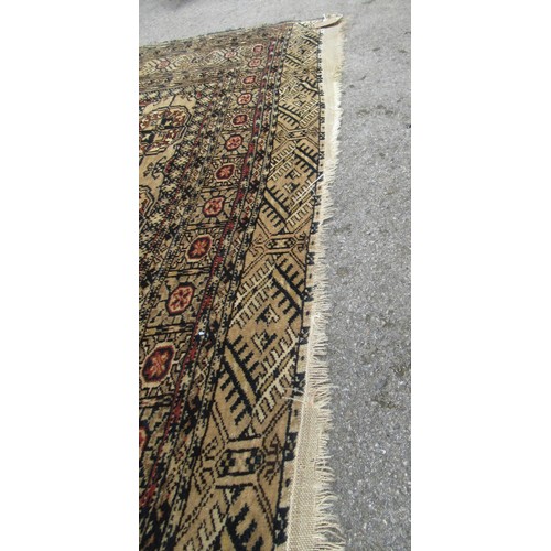 49 - Turkoman rug, the three rows of gols and multiple borders on a washed beige, red and blue ground, to... 