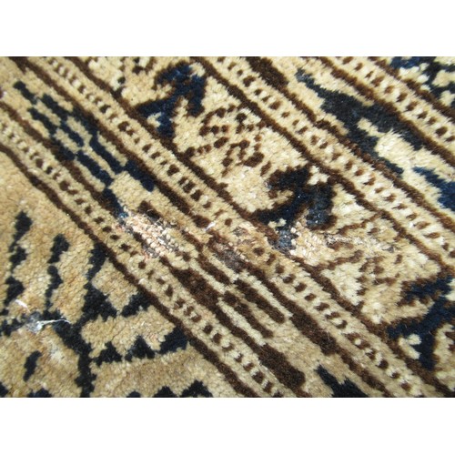 49 - Turkoman rug, the three rows of gols and multiple borders on a washed beige, red and blue ground, to... 