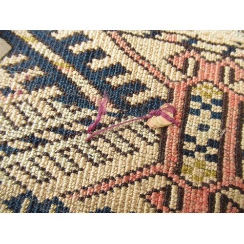 50 - Afghan rug, the three rows of eight gols and multiple borders on a washed wine, blue and beige groun... 