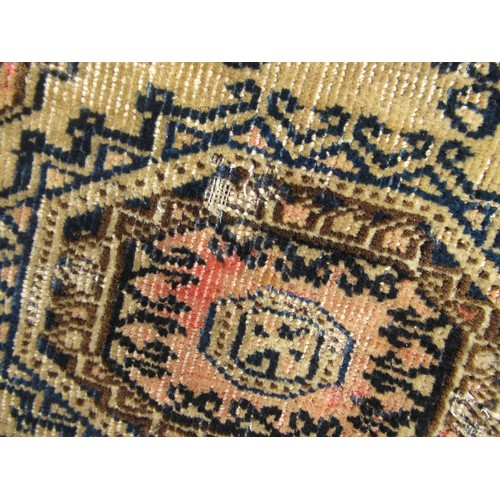 50 - Afghan rug, the three rows of eight gols and multiple borders on a washed wine, blue and beige groun... 