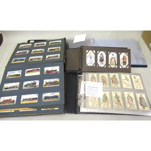 103B - Album of cigarette cards including Wills, Lambert & Butler, a small album of John Players cards, a l... 