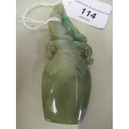 114 - Small 20th Century two colour green jade carving in the form of a two handled vase, 9cm high overall