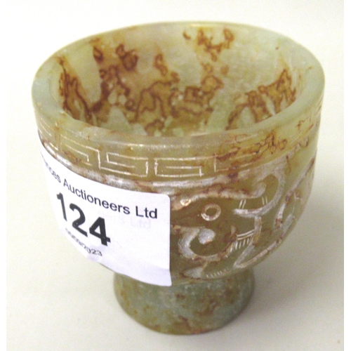 124 - 20th Century carved mottled green/rust jade stem cup, decorated in shallow relief, 5.5cm high