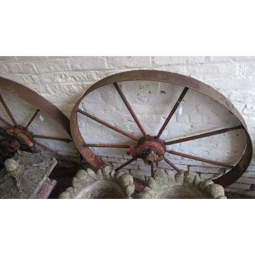 145 - Pair of vintage agricultural red painted iron belt wheels, 115cm diameter