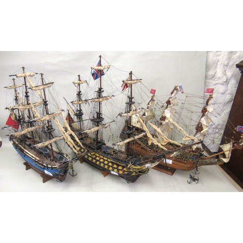 146 - Modern painted wooden built model of a three masted ship of the line, 75cm long approximately togeth... 