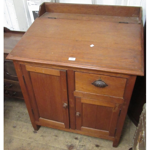 1496 - 19th Century Colonial teak clerk's desk, the hinged writing slope above two panelled doors and a dra... 