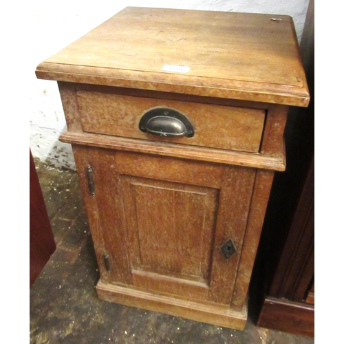 1510 - Hardwood bedside cabinet having moulded top above single drawer and panelled door on plinth base