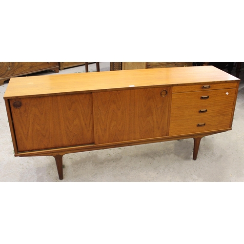 1521 - Mid 20th Century teak sideboard by Wrighton having two sliding flush doors and four drawers, 76cm hi... 