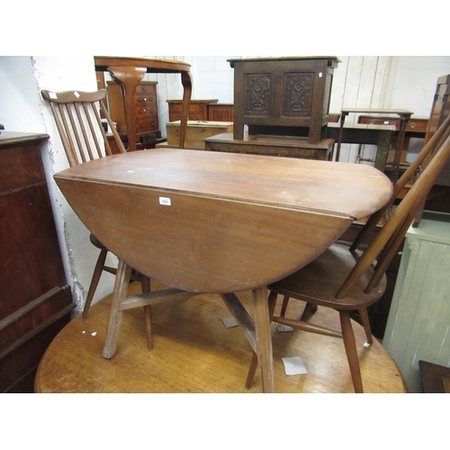 1523 - Ercol elm drop-leaf dining table together with a pair of Ercol stickback dining chairs