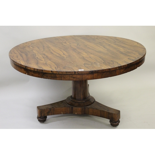 1549 - Victorian circular rosewood centre table on turned column and triform base, raised on low bun feet, ... 