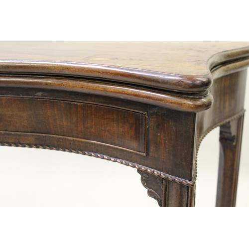 1560 - George III mahogany serpentine shaped fold-over card table, raised on square moulded supports