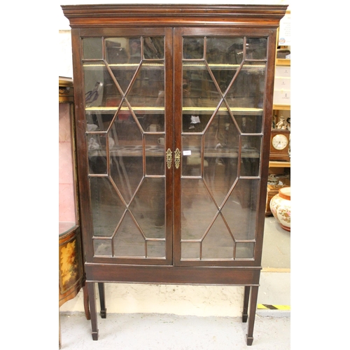 1561 - 19th Century mahogany bookcase with a moulded cornice above a pair of astragal glazed doors enclosin... 