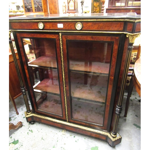 1567B - Late 19th Century ebonised amboyna banded porcelain and ormolu mounted two door pier cabinet, the sh... 