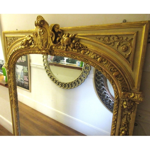 1567D - Large 19th Century gilded composition overmantel mirror, the high relief fruit, floral and scroll su... 