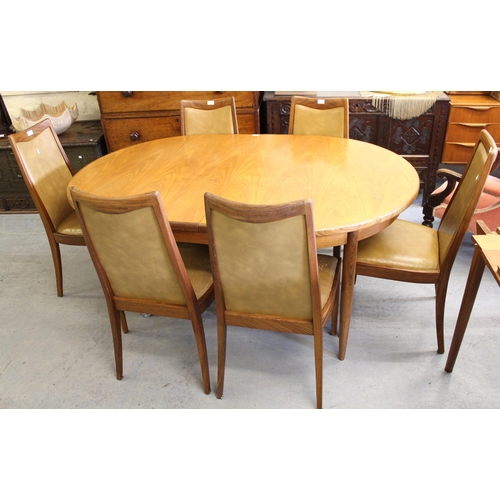 1569 - 1970's G Plan teak extending oval dining table with integral single extra fold-out leaf on turned ta... 