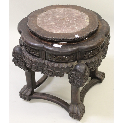 1577 - Chinese circular hardwood marble inset jardinere stand carved with maskheads, 15cm diameter, 47cm hi... 