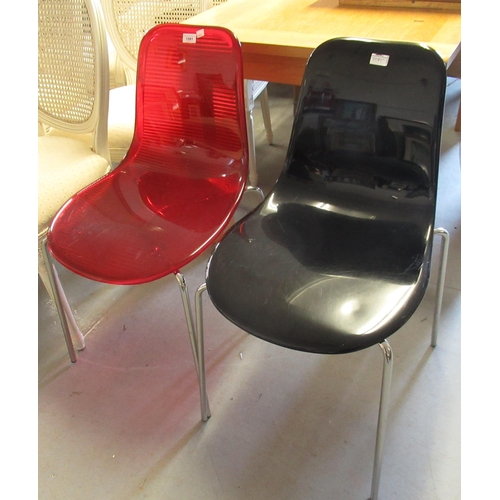 1581 - Effezeta, two designer composite chairs on chromium supports, in red and black