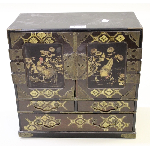 1589 - Japanese red and black lacquered chinoiserie decorated table top cabinet having panelled doors decor... 