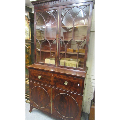 1591 - George III mahogany secretaire bookcase, the moulded dentil cornice above a pair of Gothic arched ba... 