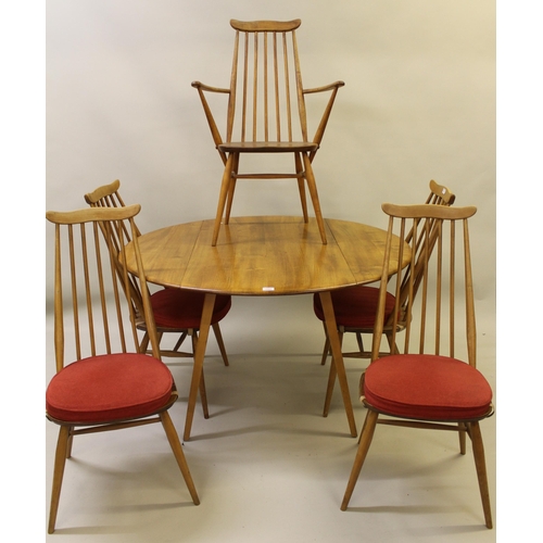 1595 - Ercol light ash circular drop-leaf dining table on splay supports, together with five (four plus one... 