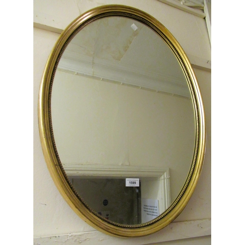 1599 - 20th Century oval gilt framed wall mirror, a dome top gilt framed wall mirror and two further 20th C... 