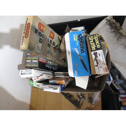 160 - Box containing a collection of various flying scale model kits, unbuilt, with two radio control unit... 