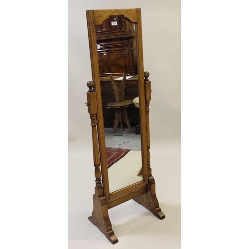 1611 - Good quality reproduction oak rectangular swing frame cheval mirror on turned supports