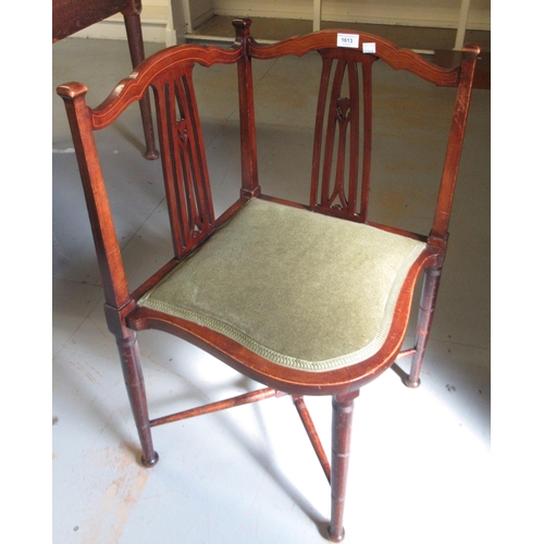 1613 - Art Nouveau mahogany corner chair with a green padded seat on tapering supports with crossover stret... 