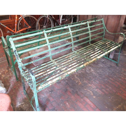 1635 - Pair of late 19th / early 20th Century green painted wrought iron garden benches, the strapwork back... 