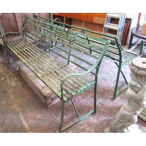 1635 - Pair of late 19th / early 20th Century green painted wrought iron garden benches, the strapwork back... 