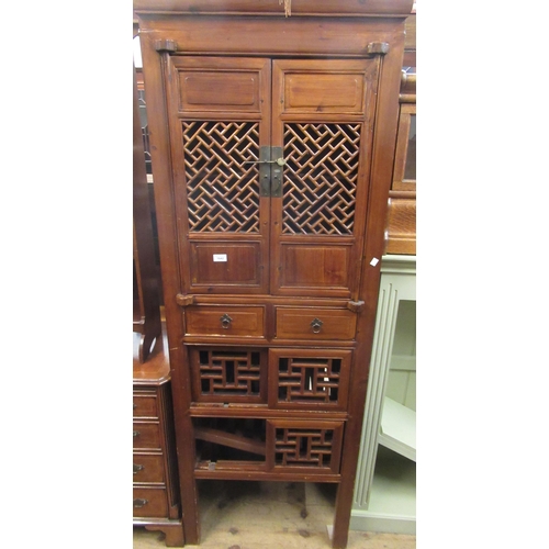 1642 - Tall Chinese side cabinet having two panelled doors with wooden grills above two short drawers and t... 