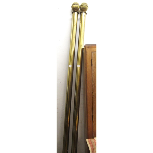 1648 - Pair of large early 20th Century gilt brass curtain poles with rings, 250cm long each