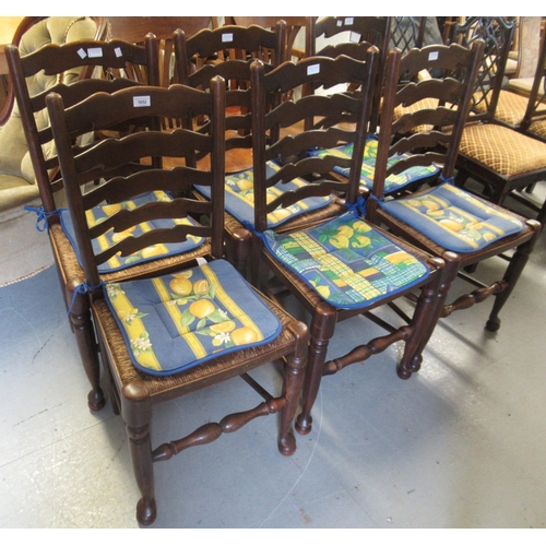 1652 - Set of six 20th Century oak ladderback dining chairs with rush seats on turned supports