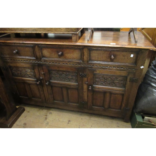 1655 - Good quality mid 20th Century reproduction oak dresser base having three drawers, above three panel ... 