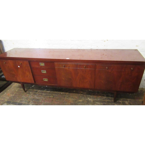 1673 - Mid 20th Century low mahogany sideboard on plain tapering supports, 76cm high x 200cm wide x 45cm de... 