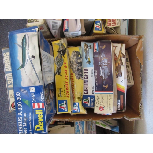 168 - Four boxes containing a large quantity of various model aircraft kits including Airfix, Italeri, Rev... 